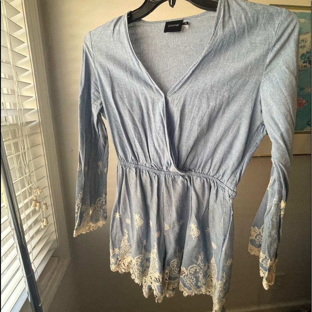 Light blue romper with white lace accents